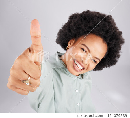 Portrait, thumbs up and black woman top view in studio isolated on a white background. Success, happiness and person with hand gesture or emoji for winning, approval or agreement, like or thank you. Portrait, thumbs up and black woman top view in studio isolated on a white background. Success, happiness and person with hand gesture or emoji for winning, approval or agreement, like or thank you. 134079889