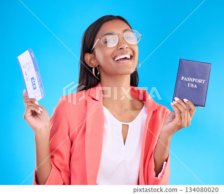 Happy woman, passport and ticket for travel, flight or USA documents against a blue studio background. Portrait of female business traveler smile holding international boarding pass or ID for trip 134080020