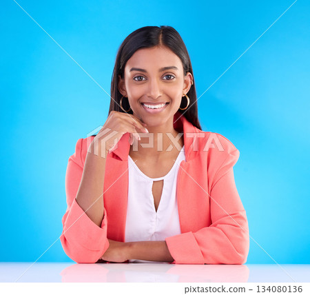 Portrait, confident and woman with smile, business and formal outfit against blue studio background. Face, female employee and executive with happiness, management and leadership skills with success Portrait, confident and woman with smile, business and formal outfit against blue studio background. Face, female employee and executive with happiness, management and leadership skills with success 134080136