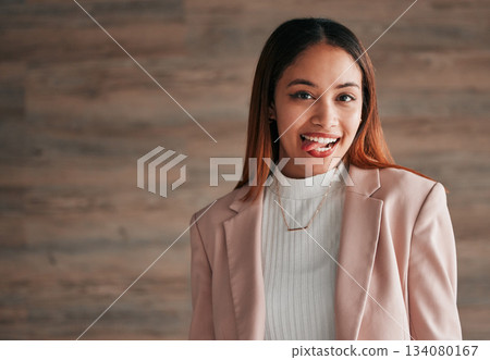 Happy, portrait and woman with her tongue out by a wall with a positive, goofy and confident mindset. Happiness, excited and headshot of a young female model fro Mexico with a silly face expression. Happy, portrait and woman with her tongue out by a wall with a positive, goofy and confident mindset. Happiness, excited and headshot of a young female model fro Mexico with a silly face expression. 134080167