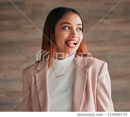Happy, beautiful and female with her tongue out by a wall with a positive, goofy and confident mindset. Happiness, comic and excited young woman model from Mexico with a silly funny face expression. Happy, beautiful and female with her tongue out by a wall with a positive, goofy and confident mindset. Happiness, comic and excited young woman model from Mexico with a silly funny face expression. 134080179