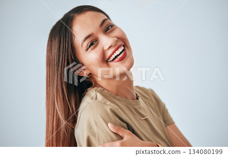 Woman is laughing, happiness and portrait with confidence isolated on studio background, comedy and carefree. Happy, young female and joy with laugh, funny and mockup with humor and positive smile Woman is laughing, happiness and portrait with confidence isolated on studio background, comedy and carefree. Happy, young female and joy with laugh, funny and mockup with humor and positive smile 134080199