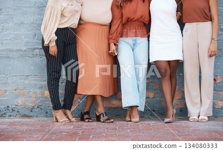 Fashion, formal and business woman legs at office against a wall in team collaboration or unity. Friends, standing and leg of professional corporate employee women in luxury outfits at workplace 134080333