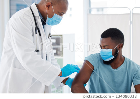 Doctor, black man and vaccine injection for covid safety, immunity and prevention. Face mask, healthcare and medical professional with vaccination syringe, cure or medicine for patient in clinic. 134080338