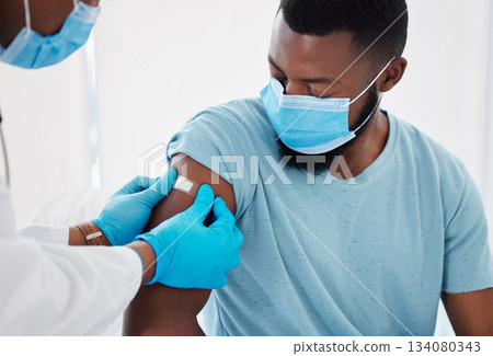 Bandage, covid vaccine with doctor and patient in hospital, safety from virus with plaster and healthcare. People in medical consultation, immunization and black man in face mask and injection wound Bandage, covid vaccine with doctor and patient in hospital, safety from virus with plaster and healthcare. People in medical consultation, immunization and black man in face mask and injection wound 134080343