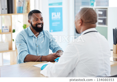Doctor, black man and healthcare consultation with a wellness and hospital worker in a office. Consulting, patient and happy male with a smile from health communication and expert advice in a clinic 134080353