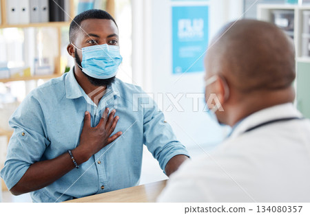 Doctor, chest pain and patient with covid in hospital for symptoms, breathing problem and consultation. Healthcare, sick black man and medical professional with face mask for treatment in clinic. Doctor, chest pain and patient with covid in hospital for symptoms, breathing problem and consultation. Healthcare, sick black man and medical professional with face mask for treatment in clinic. 134080357