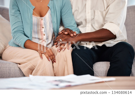 Support, love and couple holding hands in a therapy session while talking to a relationship therapist. Unity, compassion and closeup of a man and woman speaking together in at a psychology clinic. 134080614