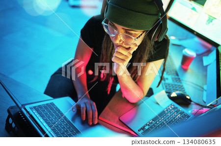 Laptop, woman and hacker thinking with music and programming for cybersecurity. Neon top view, headphones and coder reading information for hacking while streaming radio on dark web at night in home. Laptop, woman and hacker thinking with music and programming for cybersecurity. Neon top view, headphones and coder reading information for hacking while streaming radio on dark web at night in home. 134080635