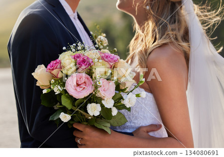 Flower bouquet, marriage hug and wedding ceremony couple for unity commitment, romantic trust or union event. Bridal flowers, love and body embrace of groom, bride or fiance in solidarity and support 134080691