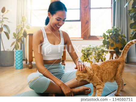 Fitness, yoga or happy woman bonding with cat or pet animal relaxing for wellness or healthy lifestyle. Smile, calm or zen girl loves caring, quality time or playing with kitten or kitty at home Fitness, yoga or happy woman bonding with cat or pet animal relaxing for wellness or healthy lifestyle. Smile, calm or zen girl loves caring, quality time or playing with kitten or kitty at home 134080751