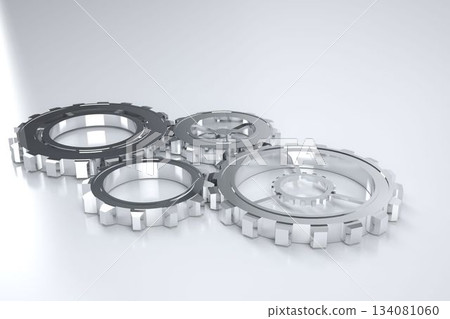 Four polished silver gears are interlocking on shiny grey surface in 3D render under soft lighting Four polished silver gears are interlocking on shiny grey surface in 3D render under soft lighting 134081060