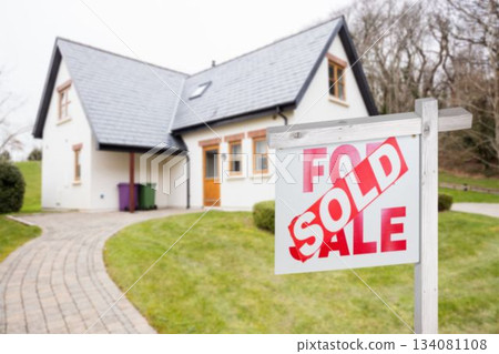 Residential building with real estate signboard 134081108