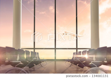 Airplane flying past departures lounge window 134081131