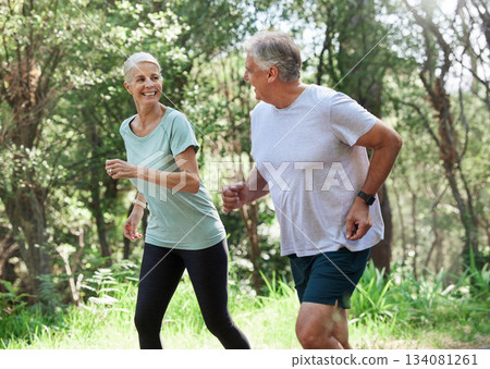Senior couple, exercise and happy outdoor for run, workout and training for fitness. Old man and woman in forest for cardio health, motivation and wellness in retirement while running in nature Senior couple, exercise and happy outdoor for run, workout and training for fitness. Old man and woman in forest for cardio health, motivation and wellness in retirement while running in nature 134081261