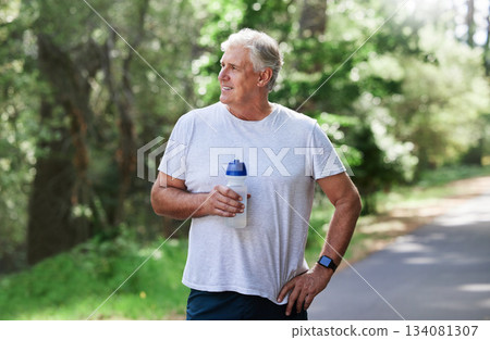 Man, exercise and thinking outdoor with water bottle for a run, workout and training for fitness. Senior male happy for hydration and cardio health or wellness while running in nature in retirement 134081307