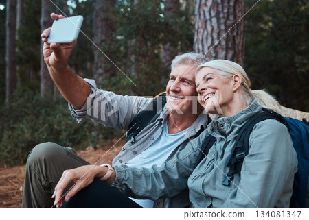 Senior couple, selfie and hiking in forest, happy people in nature with memory and social media post. Smile in picture, adventure and fitness, old man and woman with active lifestyle and outdoor Senior couple, selfie and hiking in forest, happy people in nature with memory and social media post. Smile in picture, adventure and fitness, old man and woman with active lifestyle and outdoor 134081347