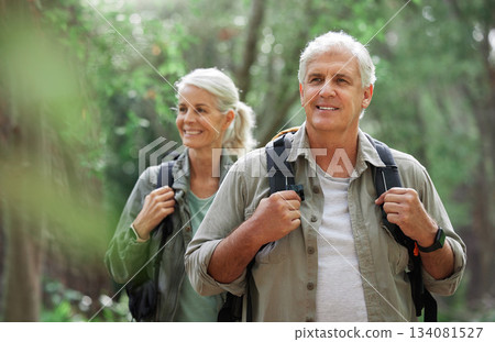 Hiking, elderly couple and active seniors in a forest, happy and relax while walking in nature. Senior, backpacker and woman with man outdoors for travel, freedom and healthy lifestyle in retirement Hiking, elderly couple and active seniors in a forest, happy and relax while walking in nature. Senior, backpacker and woman with man outdoors for travel, freedom and healthy lifestyle in retirement 134081527