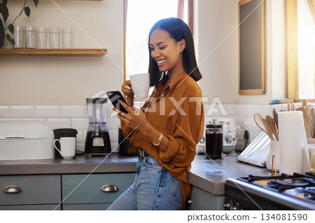 Coffee break, phone and woman standing in kitchen while browsing internet, checking social media or reading email. Chat, connect and relax, resting and latino female in apartment on a break Coffee break, phone and woman standing in kitchen while browsing internet, checking social media or reading email. Chat, connect and relax, resting and latino female in apartment on a break 134081590