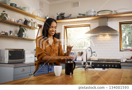 Kitchen, coffee and woman with French press for breakfast latte, cappuccino and hot beverage at home. Relax, morning routine and happy girl make espresso, caffeine drink and brewing in apartment Kitchen, coffee and woman with French press for breakfast latte, cappuccino and hot beverage at home. Relax, morning routine and happy girl make espresso, caffeine drink and brewing in apartment 134081593