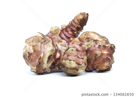 Fresh Jerusalem artichokes isolated on a white background, ready for cooking Fresh Jerusalem artichokes isolated on a white background, ready for cooking 134081650