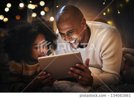 Night, tablet and happy with father and son in blanket tent for connection, relax and streaming cartoon. Smile, app and bonding with man and boy at home for education, internet and online Night, tablet and happy with father and son in blanket tent for connection, relax and streaming cartoon. Smile, app and bonding with man and boy at home for education, internet and online 134081661