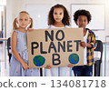 Kids, portrait and poster with friends in protest in a classroom holding a sign for eco friendly activism. Children, green and a kindergarten group standing together for community or ecology 134081718