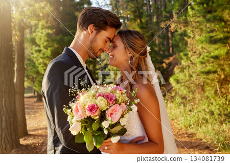Wedding, kiss and love with couple in nature for celebration, marriage and ceremony. Happiness, affectionate and romance with man and woman in forest with bouquet for elegant, relationship and hug Wedding, kiss and love with couple in nature for celebration, marriage and ceremony. Happiness, affectionate and romance with man and woman in forest with bouquet for elegant, relationship and hug 134081739