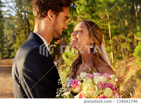 Love, bride and groom with smile, outdoor and cheerful for special day, loving and bonding. Romance, man and woman on wedding day, passionate and affectionate in nature, forest or celebration outside Love, bride and groom with smile, outdoor and cheerful for special day, loving and bonding. Romance, man and woman on wedding day, passionate and affectionate in nature, forest or celebration outside 134081740