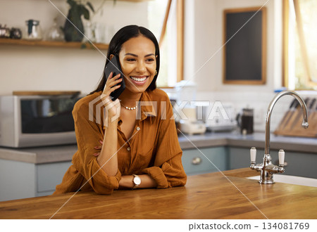 Smile, kitchen and phone call, latino woman networking for freelance job or remote work in home. Chat, connect and communication with home lifestyle, morning conversation on smartphone in apartment. 134081769