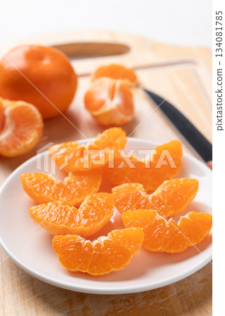 Fresh cut of Mandarin orange fruit on plate ready to eating 134081785