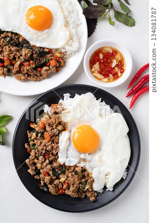 Thai food, Stir fried holy basil with minced pork with cooked rice and fried egg on top 134081787