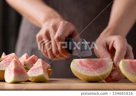 Red guava cutting on wooden board, Tropical fruit high vitamin C Red guava cutting on wooden board, Tropical fruit high vitamin C 134081816