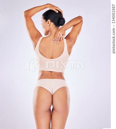 Back skincare, woman body and butt in a studio with wellness, underwear and fitness. Cosmetics, liposuction and cellulite beauty treatment of a female with skin glow with isolated white background Back skincare, woman body and butt in a studio with wellness, underwear and fitness. Cosmetics, liposuction and cellulite beauty treatment of a female with skin glow with isolated white background 134081987