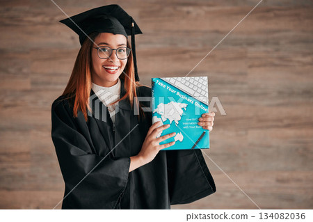 Graduate, woman portrait and business textbook of a young student happy from graduation. Learning book, happiness and excited female ready for university education with a smile from knowledge Graduate, woman portrait and business textbook of a young student happy from graduation. Learning book, happiness and excited female ready for university education with a smile from knowledge 134082036