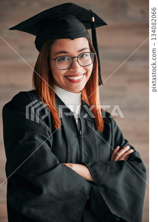 Graduation cap, proud portrait and woman isolated on wood background happy education, college or scholarship success. Biracial person, university student or graduate with learning knowledge mindset Graduation cap, proud portrait and woman isolated on wood background happy education, college or scholarship success. Biracial person, university student or graduate with learning knowledge mindset 134082066