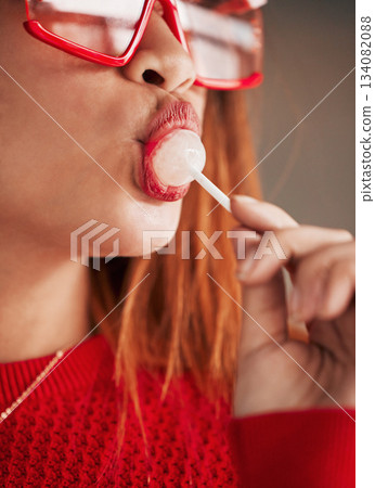 Lollipop, woman and lips with makeup, cosmetics and gen z style eating a sweet candy. Mouth, young person and studio with brown background and a female model with sweets and fashion aesthetic Lollipop, woman and lips with makeup, cosmetics and gen z style eating a sweet candy. Mouth, young person and studio with brown background and a female model with sweets and fashion aesthetic 134082088