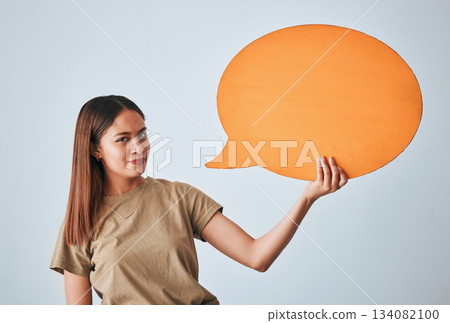 Speech bubble, smile and portrait of woman in studio isolated on a white background. Social media, poster and happy girl with billboard for voice, opinion or branding, marketing or advertising space. Speech bubble, smile and portrait of woman in studio isolated on a white background. Social media, poster and happy girl with billboard for voice, opinion or branding, marketing or advertising space. 134082100