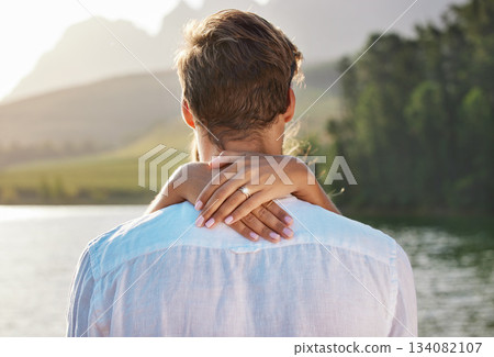 Engagement, hug and couple by lake for romantic holiday, vacation and honeymoon in nature together. Love, proposal mockup and hands of woman holding man for embrace, hugging and affection outdoors Engagement, hug and couple by lake for romantic holiday, vacation and honeymoon in nature together. Love, proposal mockup and hands of woman holding man for embrace, hugging and affection outdoors 134082107