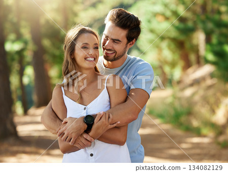 Couple hug in nature park, happy and relationship with love and trust, travel and adventure. Young people in forest, outdoor and happiness together with smile, embrace with commitment and care Couple hug in nature park, happy and relationship with love and trust, travel and adventure. Young people in forest, outdoor and happiness together with smile, embrace with commitment and care 134082129