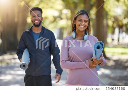 Fitness, couple and portrait smile for yoga, spiritual wellness or healthy exercise together in nature. Happy woman and man yogi smiling with mat for calm zen training, practice or workout at a park Fitness, couple and portrait smile for yoga, spiritual wellness or healthy exercise together in nature. Happy woman and man yogi smiling with mat for calm zen training, practice or workout at a park 134082168