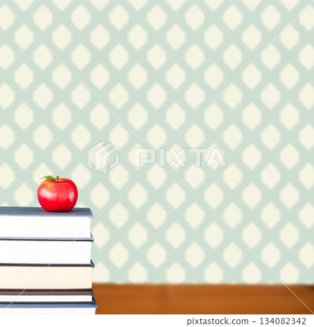 Red apple on pile of books 134082342
