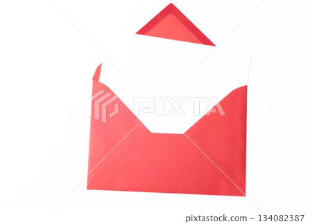 Paper in red envelope against white background 134082387