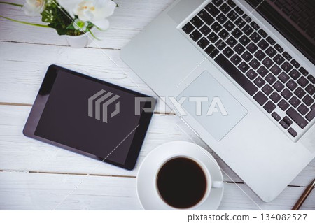 Tablet and laptop on table Tablet and laptop on table 134082527