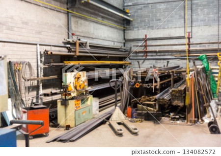 Flat design metal shop is showing horizontal rack holding steel bars with cutting machine Flat design metal shop is showing horizontal rack holding steel bars with cutting machine 134082572