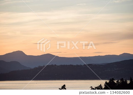 Scenic view of silhouette mountains by sea Scenic view of silhouette mountains by sea 134082600
