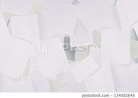 Flat design showing blank sheets scattering across workspace with grid mat, folded triangle 134082648