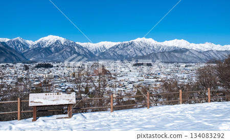 View of the Northern Alps from Omachi Park (winter) 134083292