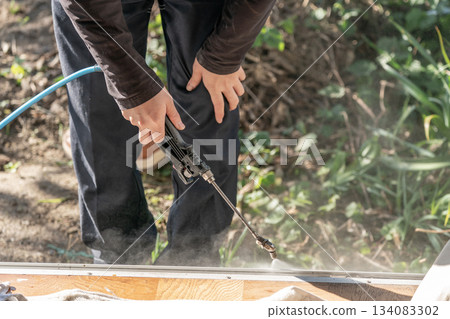 High-pressure washing of window sashes High-pressure washing of window sashes 134083302
