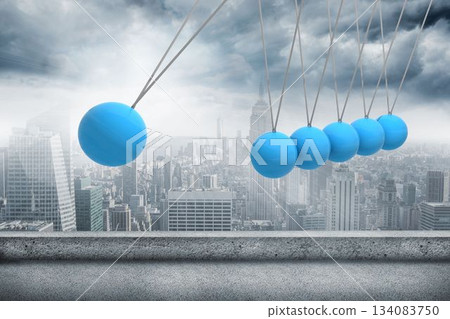 Newtons cradle above city 134083750